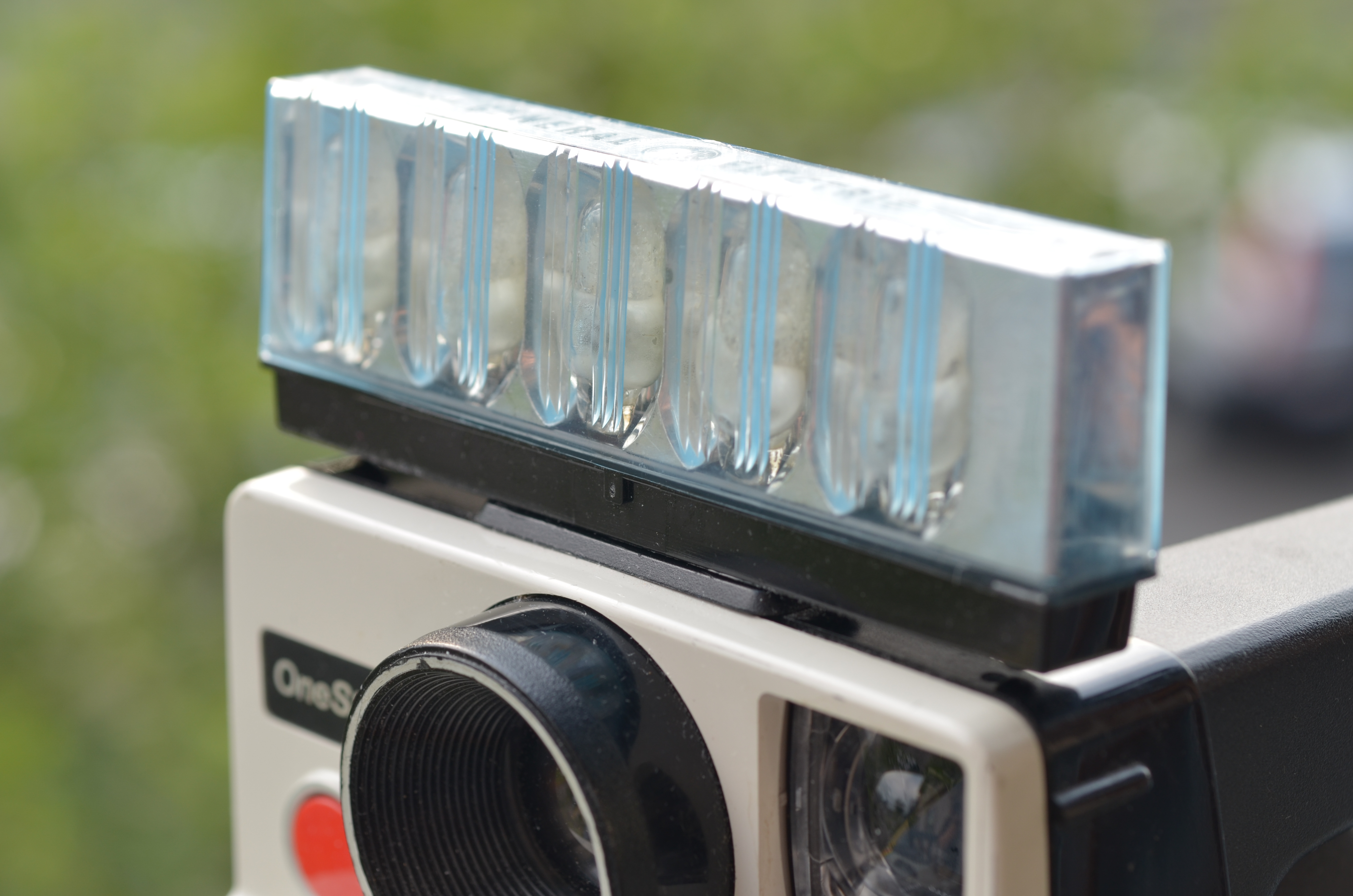 one step polaroid land camera flash bar