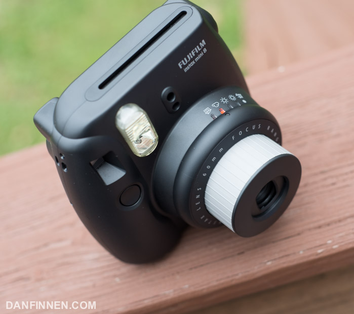 On the Instax 8 exposure is manually set with a ring on top of the lens.